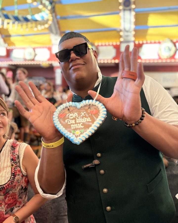 Team member with gingerbread heart in the tent