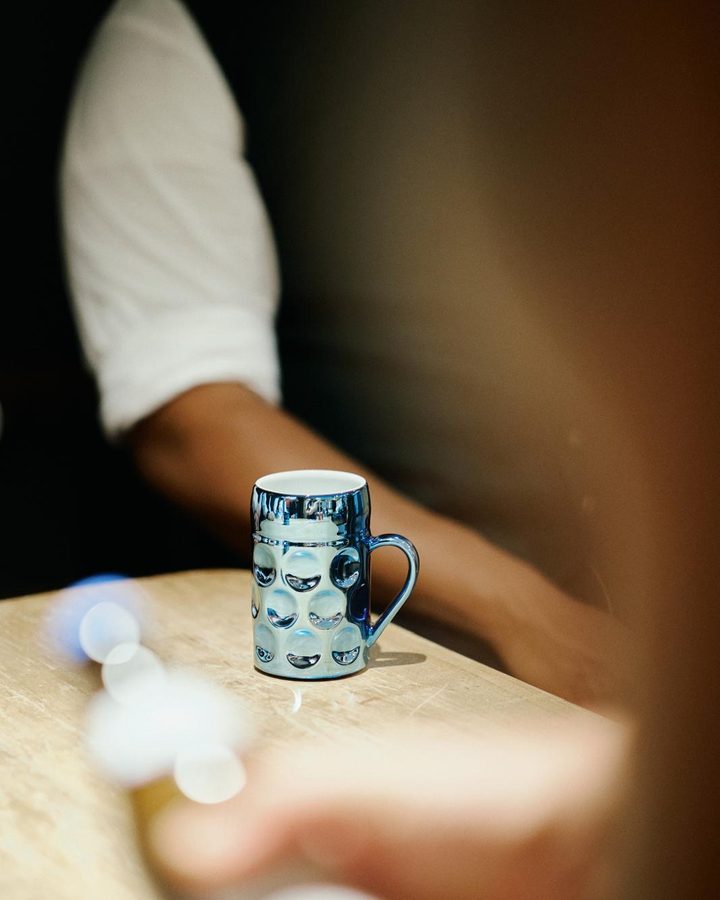 A blue mug on the table